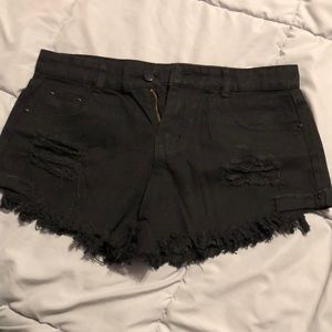 Black shorts with fringe on ends